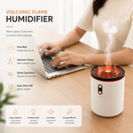USB jellyfish humidifier casting a warm orange volcanic flame glow in a dimly lit bedroom